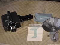 Camera, flash unit with reflector, pouch, instruction sheet