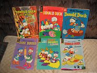 Six comics including Donald Duck Adventures, Donald Duck, Daisy and Donald, Junior Woodchucks