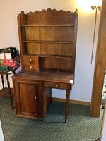 Full view of cabinet showing hutch top, drawers, cupboard and desk surface