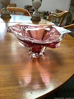 Overall view of pink freeform glass dish on table
