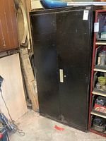 Front view of black steel cabinet closed