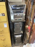 Full view of RCA stereo main unit stacked with two speakers