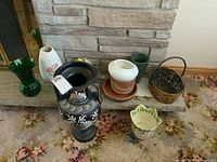 Group shot showing amphora, glass vase, bud vase, planters, basket