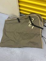 Folded Browning Buckmark bench seat cover with visible logo and strap