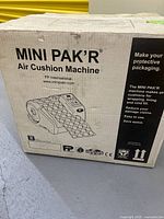 Product carton with MINI PAK'R branding