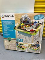 Sealed retail box front showing KidKraft Rocky Mountain Train Set & Table, 50-piece count and product illustration