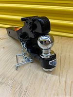 Overall view of Reese pintle combo hitch showing pintle, chrome ball, safety pin and chain