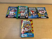 Front covers of the five Captain Underpants books