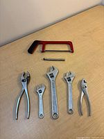 All seven tools laid out on tabletop