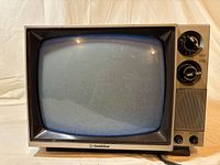 Front view showing screen, GoldStar logo, controls and cabinet finish