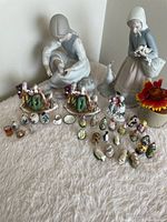 Full lot overview showing all figurines and miniatures grouped on surface