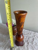 Front view showing full vase with measuring tape indicating ~10 in height