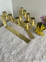 Both brass candle holders showing overall shape and five-socket design