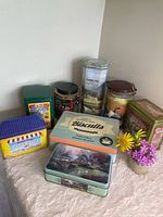 Group shot of all eight tins