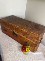 Top and side view of leather-bound pine chest
