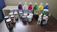 Overview of all paints and glitter on table