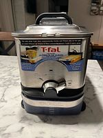 Front view of T-Fal Ultimate EZ Clean deep fryer showing branding and controls
