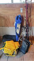 Overall lot showing rods, boots, chair bag, yellow bag, black case
