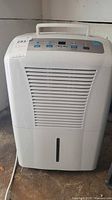 Front view of GE ADEL50LRL2 humidifier showing grill and control panel
