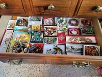 Entire drawer with numerous boxed costume jewelry pieces