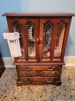 full view of wood jewelry chest closed