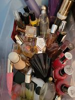 Overall view of storage box with perfume minis and nail polishes