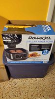 Retail box showing PowerXL Grill Air Fryer Home 5.5 qt