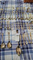 Flatware laid out showing knives, forks, spoons and serving pieces