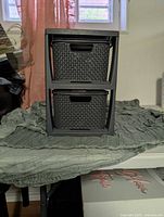 Front view showing two dark gray woven-look plastic drawers in organizer