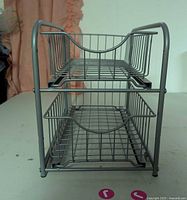 Front view of 2-tier gray metal wire organizer showing both drawers