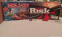 Front view of both board game boxes