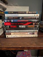 Stacked view of all 14 movie cases, spines visible