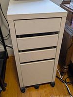 front view of white IKEA rolling pedestal with drawers closed