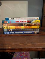 Stacked view of six movie cases showing titles and formats