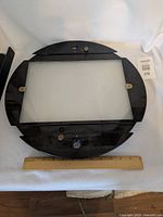 Top view of black animation disc showing translucent drawing window and diameter reference ruler