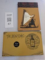 Front covers of both Gorey hardcovers and lot reference card