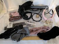 All items overview: straightener, glove, mat, bands, headbands, pins, comb