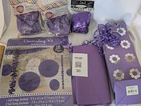 Full lot showing decorating kit, balloons, confetti, tissue paper, gift bag and ribbon