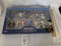 Front view of sealed boxed set showing all figurines