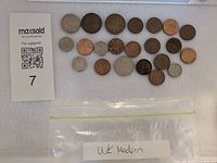 All coins laid out with lot card and bag showing label