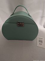 Front view closed showing handle and clasp