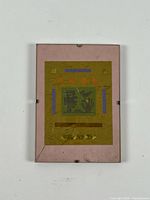 Full view of framed mixed media artwork