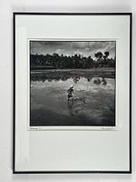 Full view of framed photograph with mat and frame