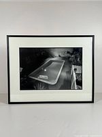 Front view of framed photograph with mat and black frame