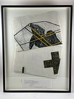 Full view of framed artwork showing both printed bags inside shadow-box frame