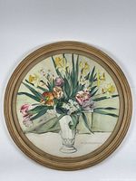 Full view of round framed painting