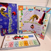 Box lid, unfolded board showing title and layout