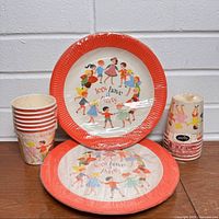 Front view of sealed plates and cups displaying graphics and packaging