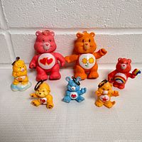 All seven Care Bear figures front view