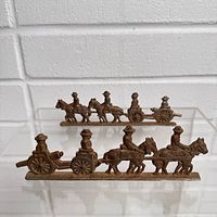 Front view of both flat metal Civil War silhouettes showing full detail and scale relative to each other